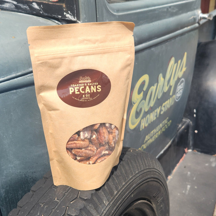 Toasted and Salted Pecans 8 oz on a spare tire of a vintage truck