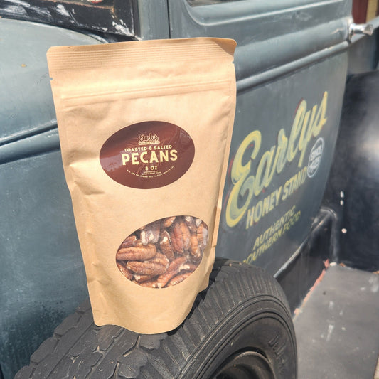 Toasted and Salted Pecans 8 oz on a spare tire of a vintage truck