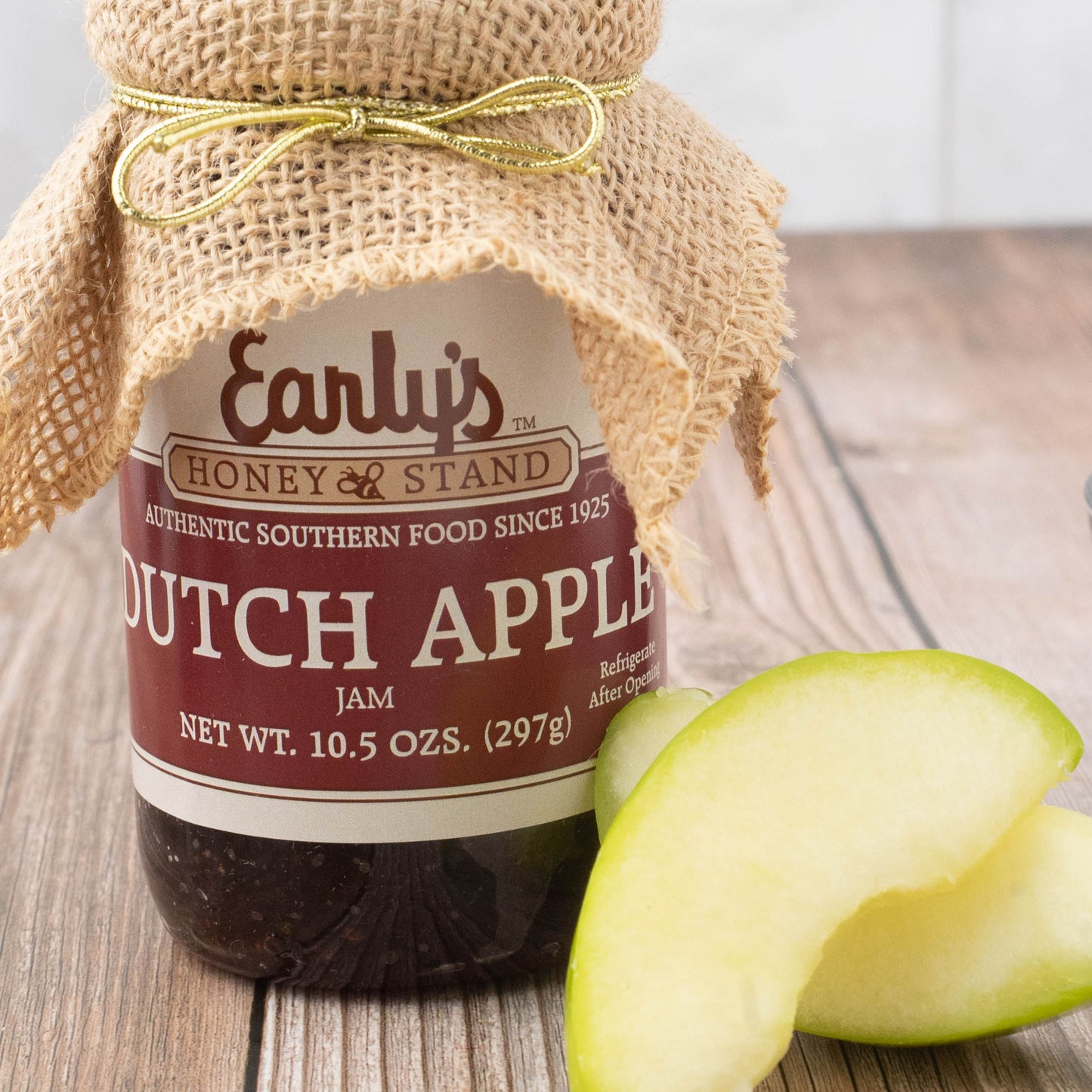 Dutch Apple Jam, Delicious, Favorite Country Jam. A 10.5 oz jar with a burlap topper next to some sliced apples